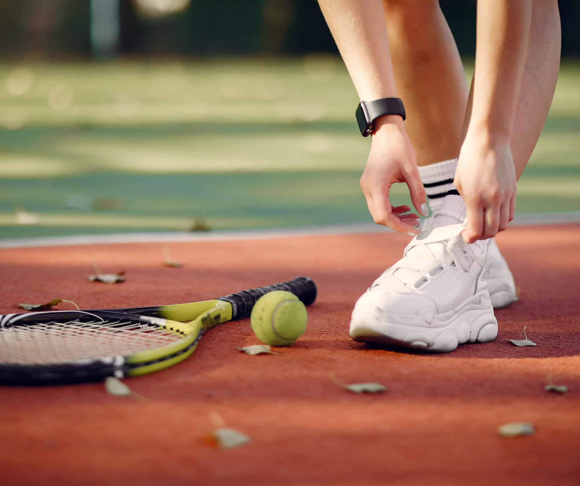 Beautiful and stylish girl on the tennis court